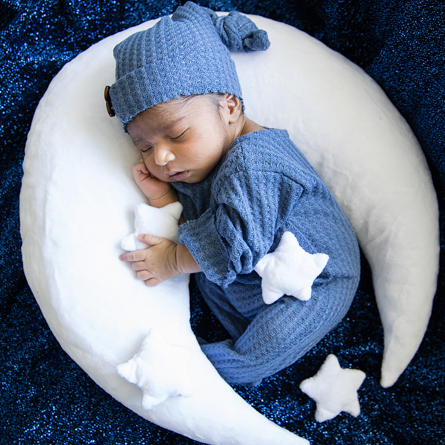 Sleeping baby with moon pillow portrait photography